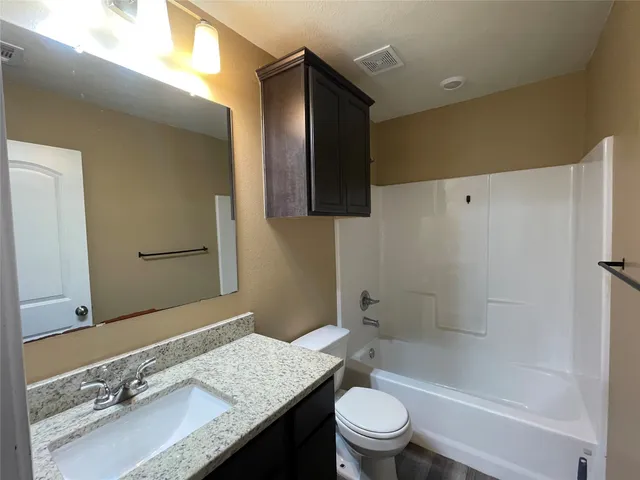 an empty room with closet area