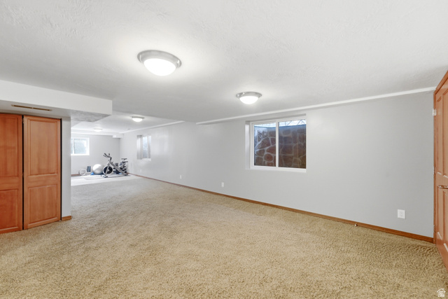 2073 Village Point Way Sandy, UT 84093 - Photo 39 of 68 Expansive carpeted room