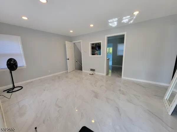 a view of a livingroom with a staircase