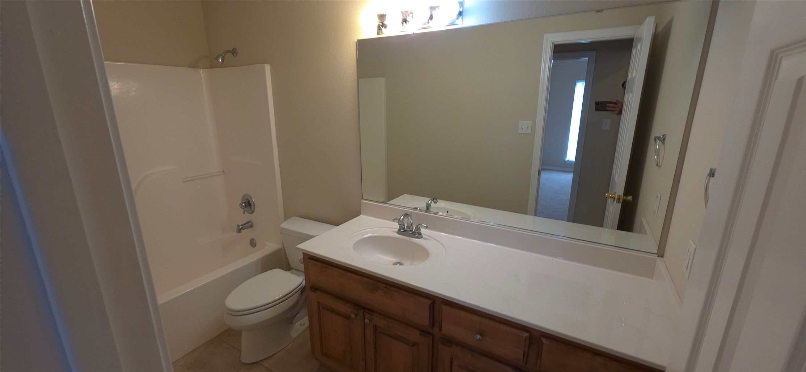 215 Bridgeview Drive Onalaska, TX 77360 - Photo 17 of 29 a bathroom with a sink a toilet and shower