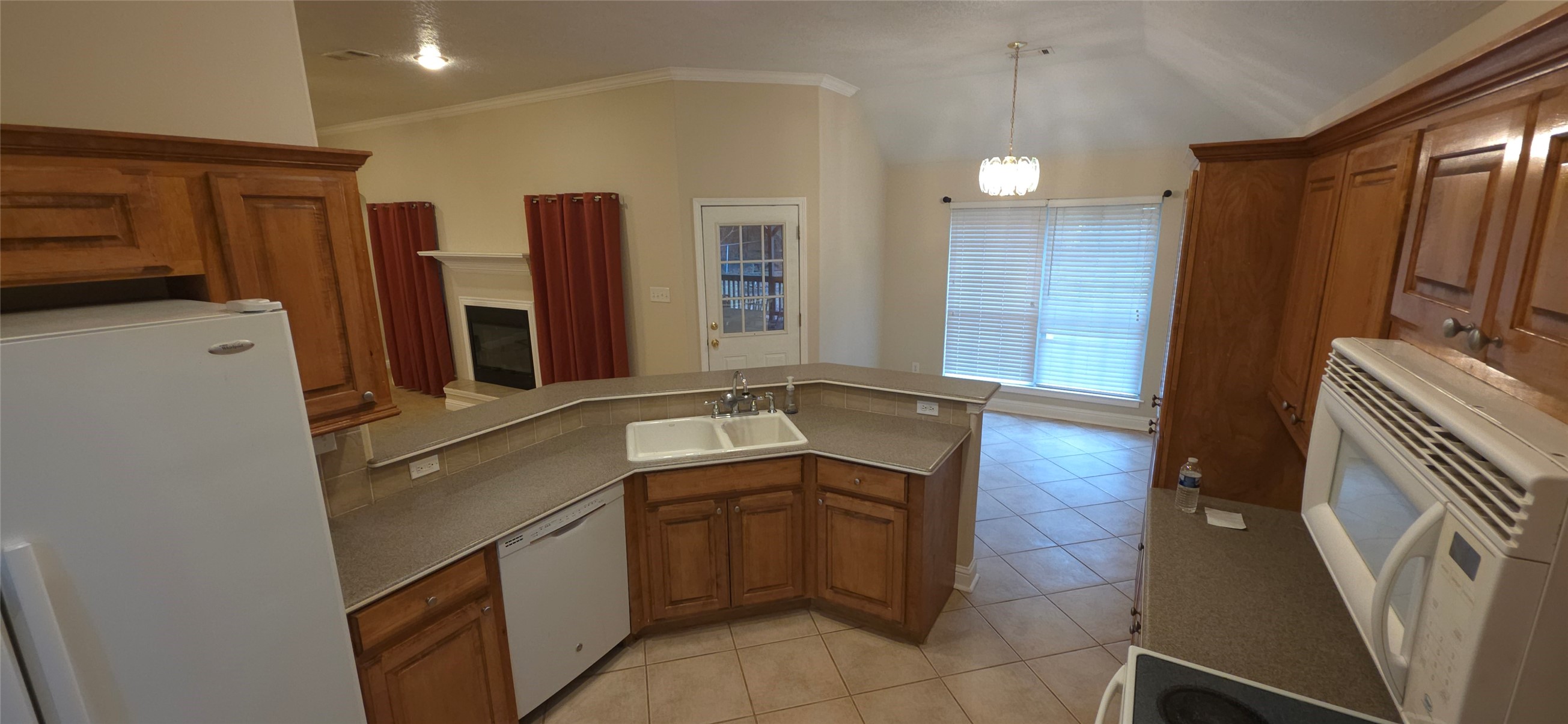 215 Bridgeview Drive Onalaska, TX 77360 - Photo 8 of 29 a kitchen with a sink and a refrigerator