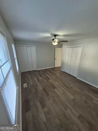 a view of an empty room with a chandelier