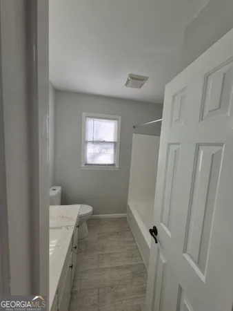 a bathroom with a sink and a toilet