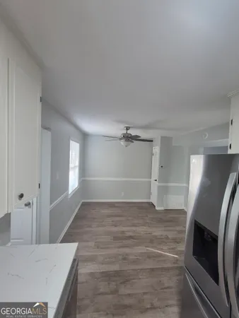 a view of a kitchen from the hallway
