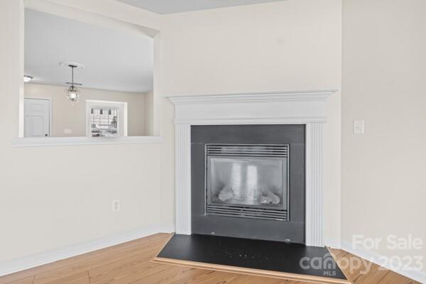 264 Ranlo Avenue Gastonia, NC 28054 - Photo 11 of 44 a view of an empty room with wooden floor and wall