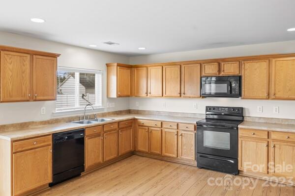 264 Ranlo Avenue Gastonia, NC 28054 - Photo 13 of 44 a kitchen with stainless steel appliances granite countertop a stove and a sink