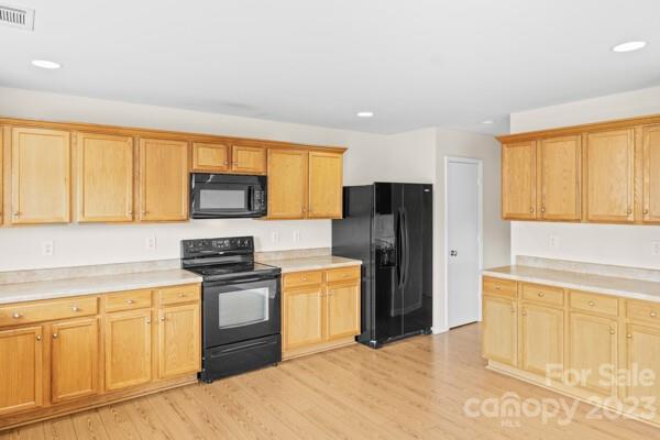 264 Ranlo Avenue Gastonia, NC 28054 - Photo 14 of 44 a kitchen with a refrigerator sink and cabinets