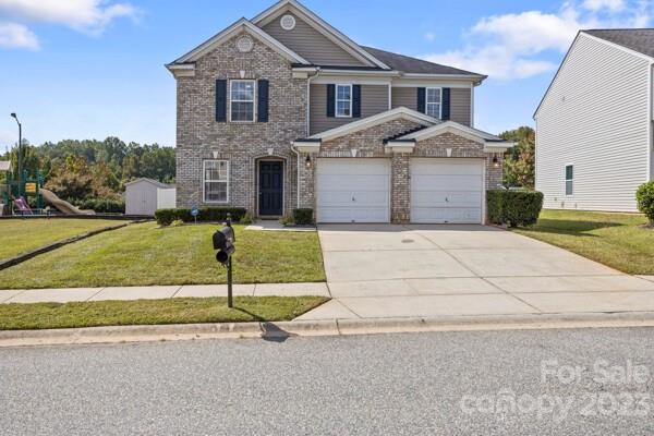 264 Ranlo Avenue Gastonia, NC 28054 - Photo 2 of 44 a front view of a house with a yard and garage