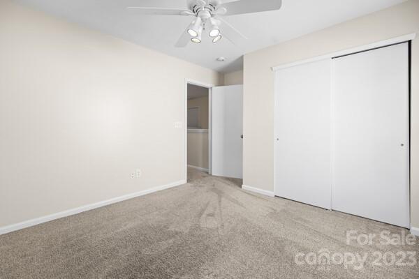 264 Ranlo Avenue Gastonia, NC 28054 - Photo 23 of 44 an empty room with chandelier fan and closet