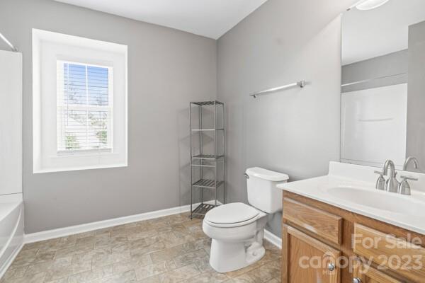 264 Ranlo Avenue Gastonia, NC 28054 - Photo 24 of 44 a bathroom with a toilet sink and a mirror