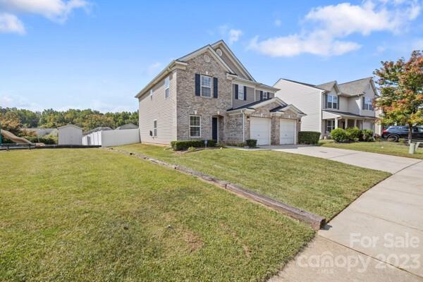 264 Ranlo Avenue Gastonia, NC 28054 - Photo 4 of 44 a front view of a house with a yard