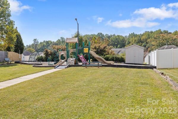 264 Ranlo Avenue Gastonia, NC 28054 - Photo 44 of 44 a view of a swimming pool with a yard and mountain view