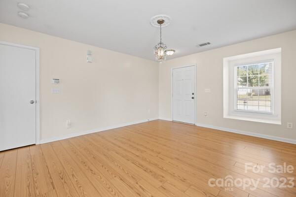 264 Ranlo Avenue Gastonia, NC 28054 - Photo 8 of 44 a view of an empty room with a window