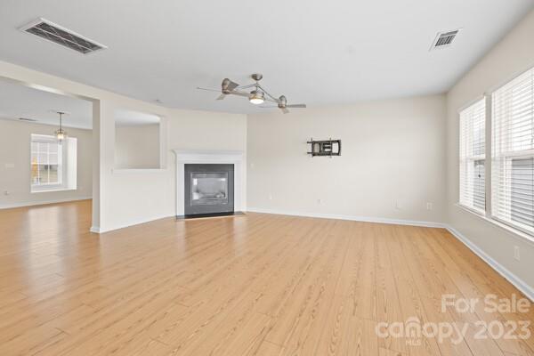 264 Ranlo Avenue Gastonia, NC 28054 - Photo 10 of 44 wooden floor in an empty room with a window