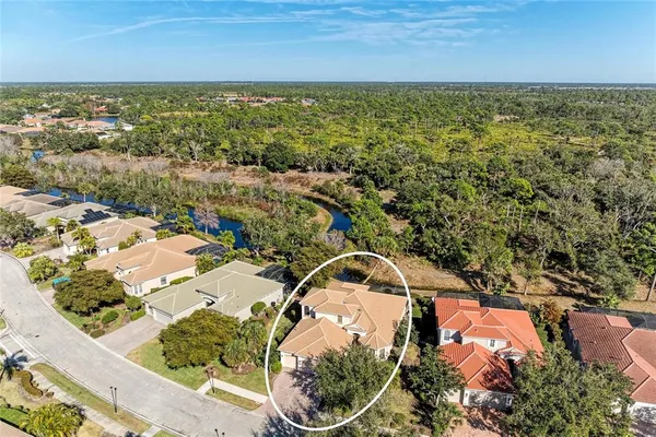 an aerial view of residential houses with outdoor space