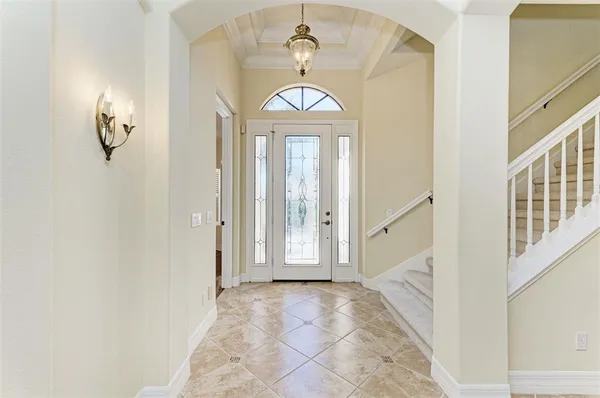 a view of an entryway with a chandelier