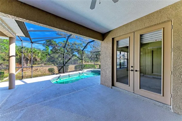 a view of a house with swimming pool and yard