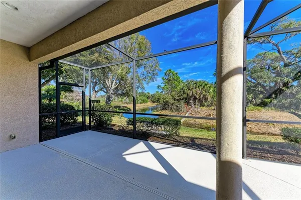 a swimming pool with outdoor seating and yard