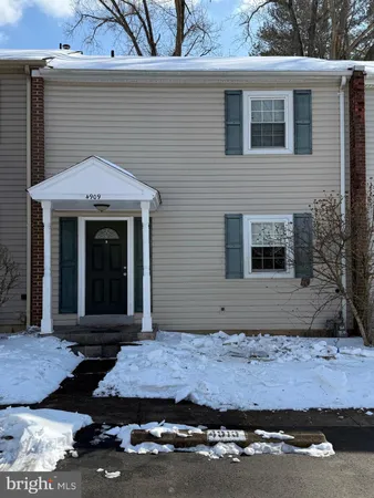 a front view of a house with garage