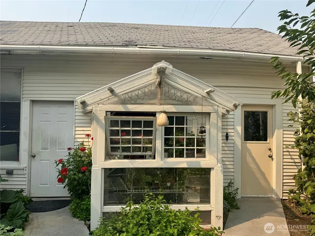 a outdoor living space with furniture and a flat screen tv