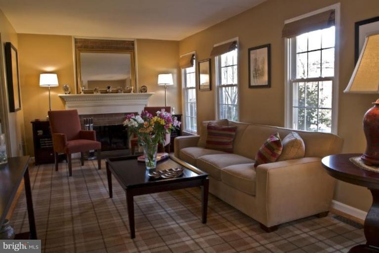 12300 Coleraine Court Reston, VA 20191 - Photo 1 of 28 a living room with furniture and a fireplace