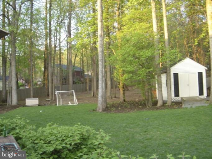 12300 Coleraine Court Reston, VA 20191 - Photo 22 of 28 a view of a house with backyard and garden
