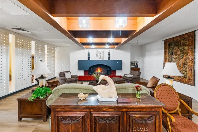 a view of a livingroom with furniture window and wooden floor