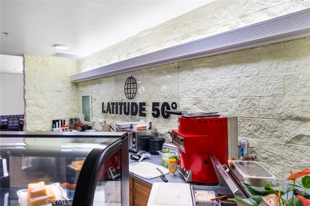 a dining room with furniture and a rug