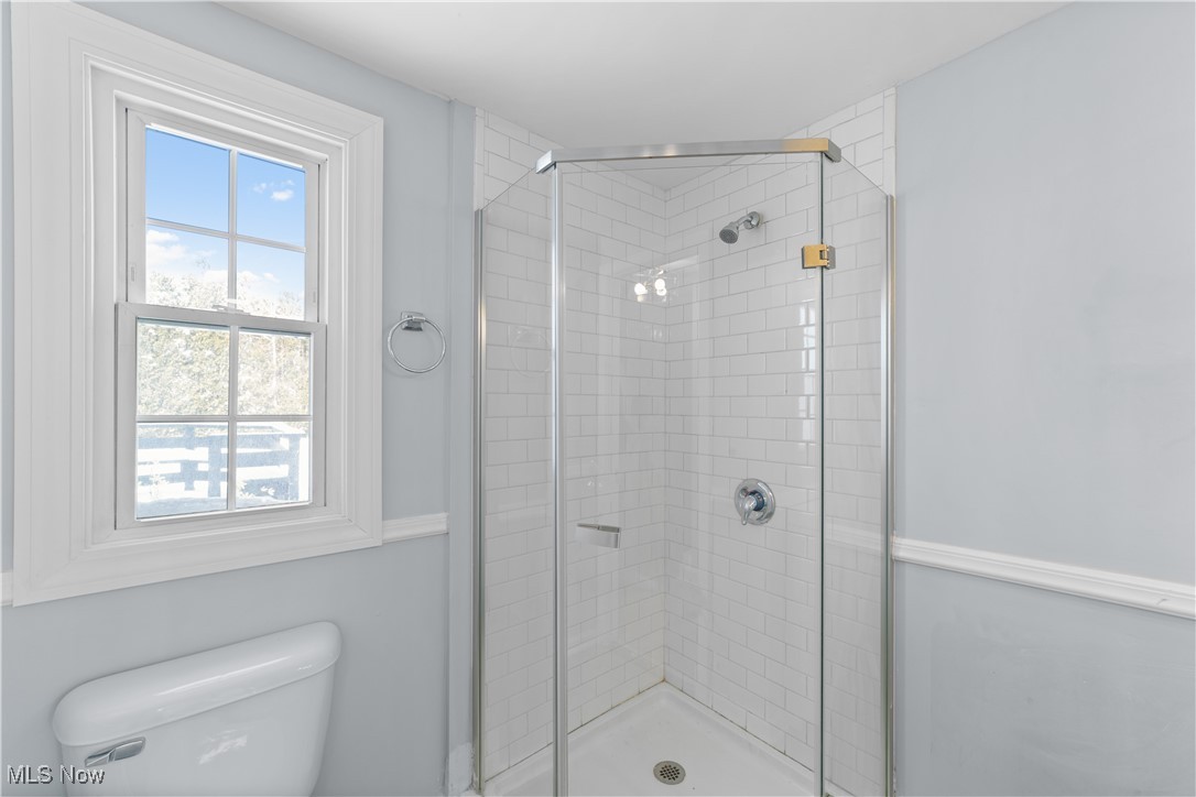 4249 Stonehaven Road Cleveland, OH 44121 - Photo 15 of 33 Bathroom featuring toilet and a shower with shower door