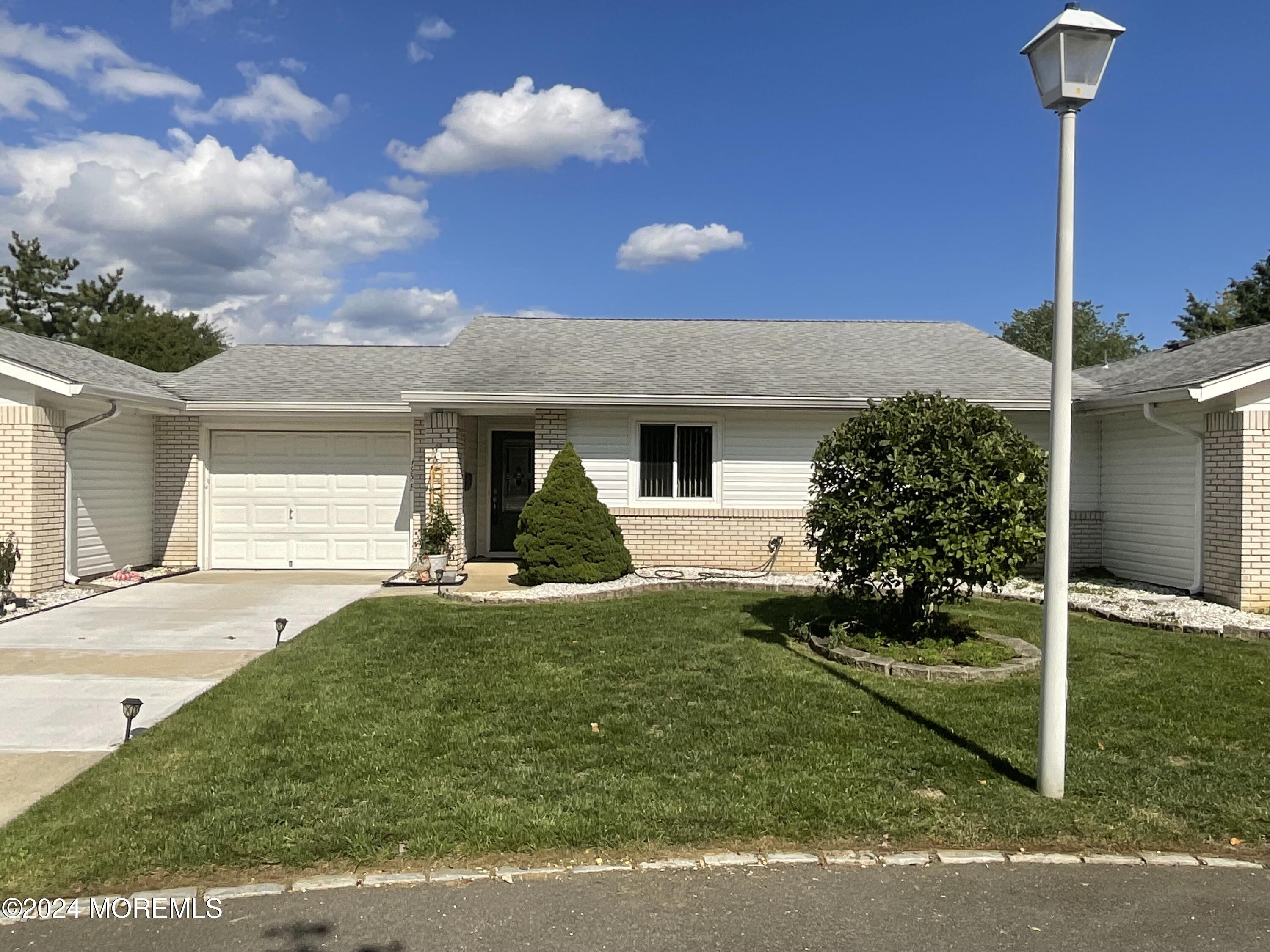 195 B Newport Road, Unit 195B Monroe Township, NJ 08831 - Photo 1 of 1 a view of a house with backyard and garden