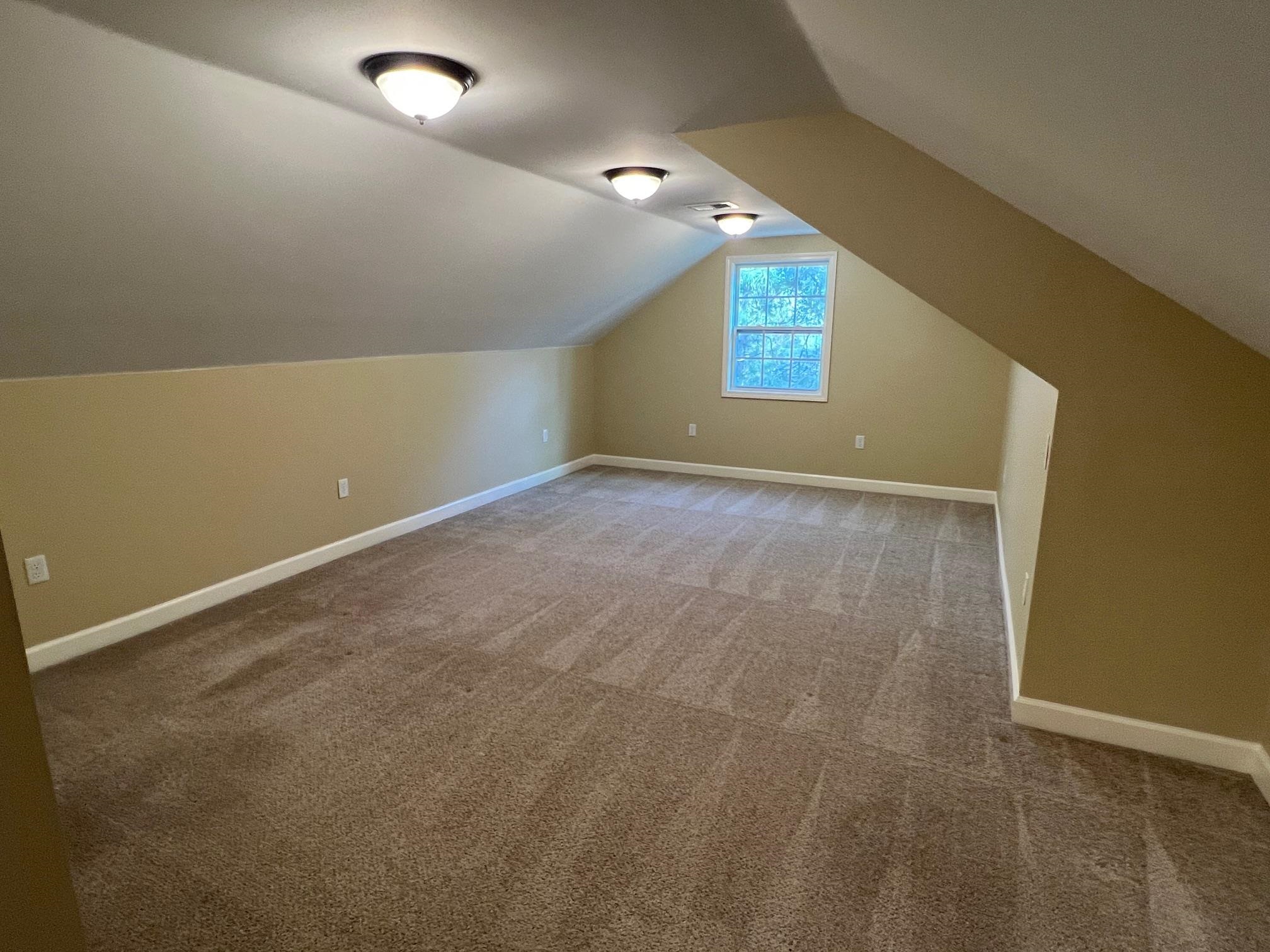 262 East Poplar Avenue Collierville, TN 38017 - Photo 15 of 19 an empty room with windows
