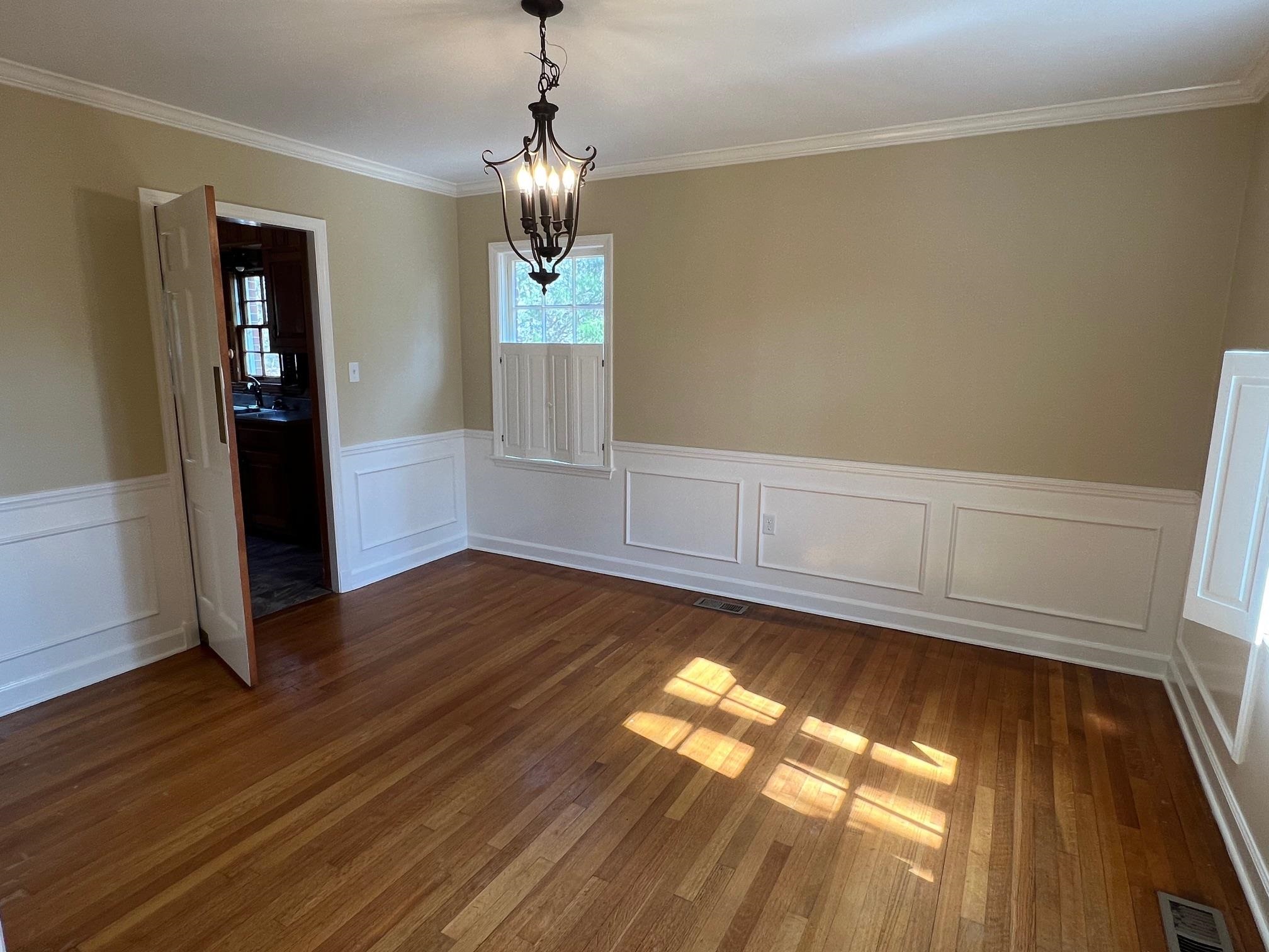 262 East Poplar Avenue Collierville, TN 38017 - Photo 3 of 19 a view of empty room with wooden floor