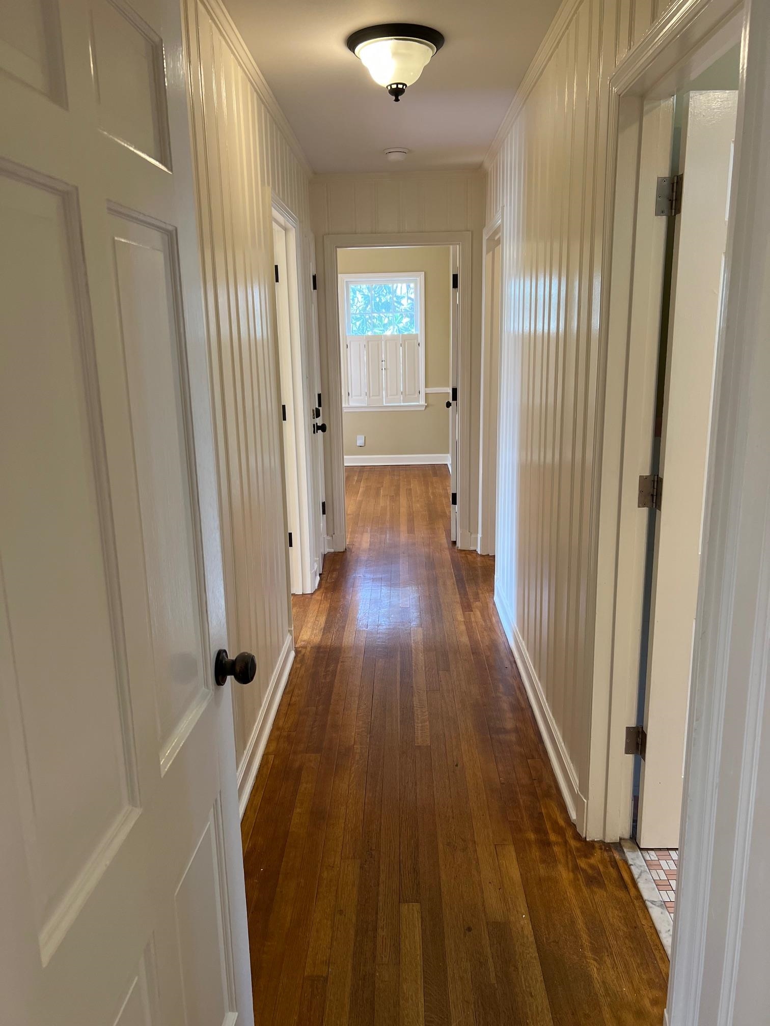 262 East Poplar Avenue Collierville, TN 38017 - Photo 8 of 19 a view of a hallway with wooden floor and closet