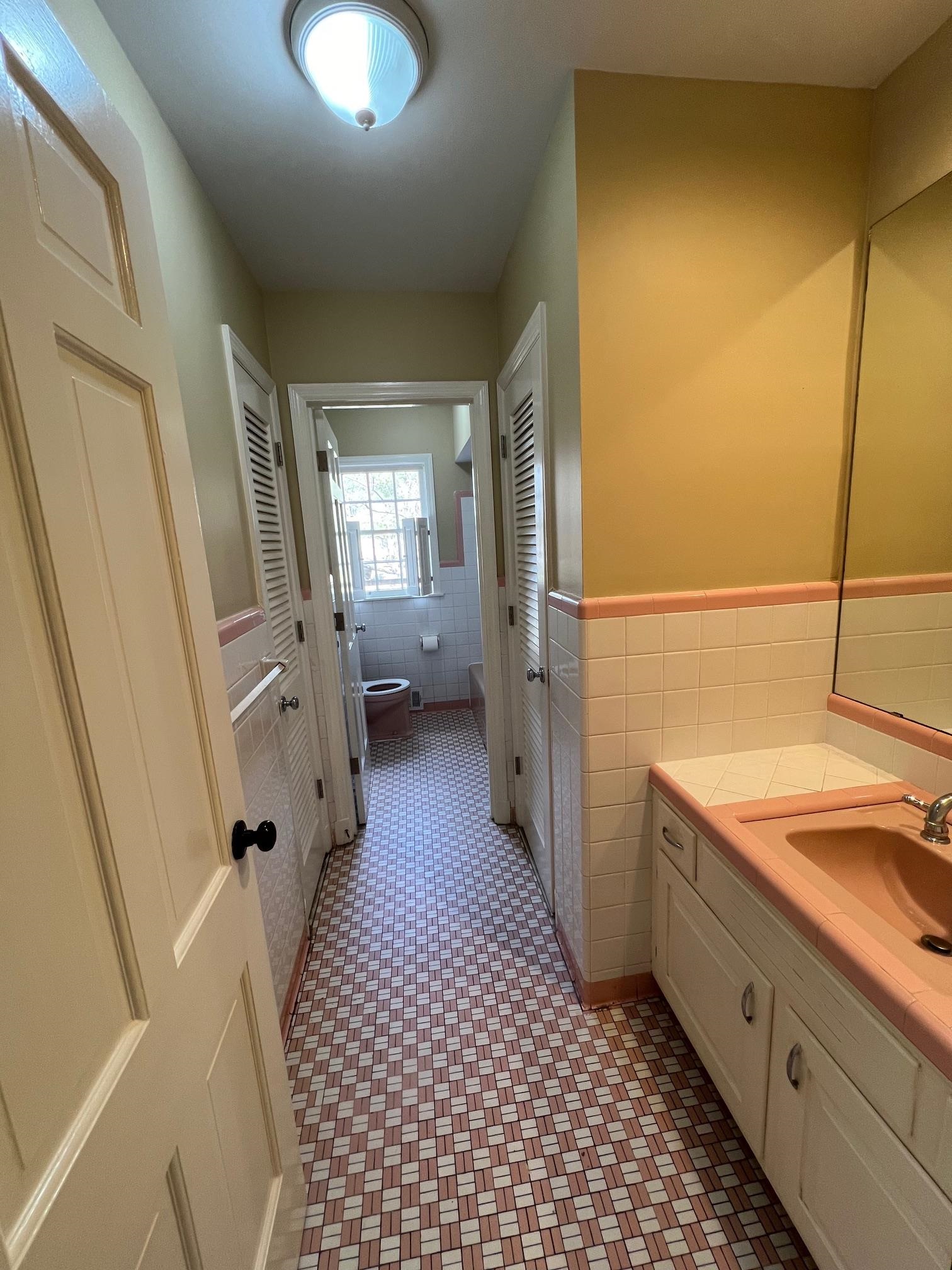 262 East Poplar Avenue Collierville, TN 38017 - Photo 9 of 19 a bathroom with a sink a mirror and a shower