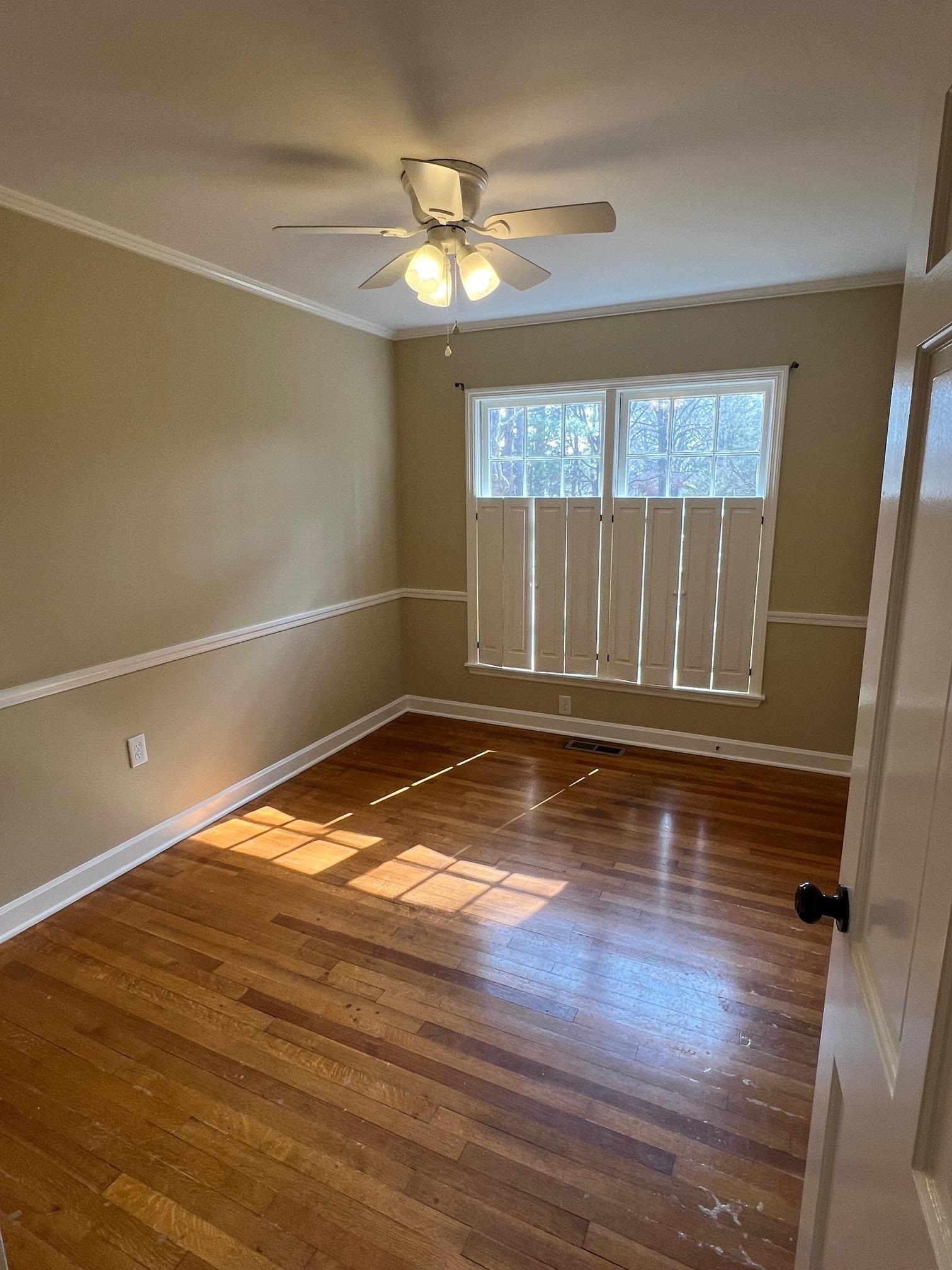 262 East Poplar Avenue Collierville, TN 38017 - Photo 10 of 19 a view of empty room with wooden floor and fan