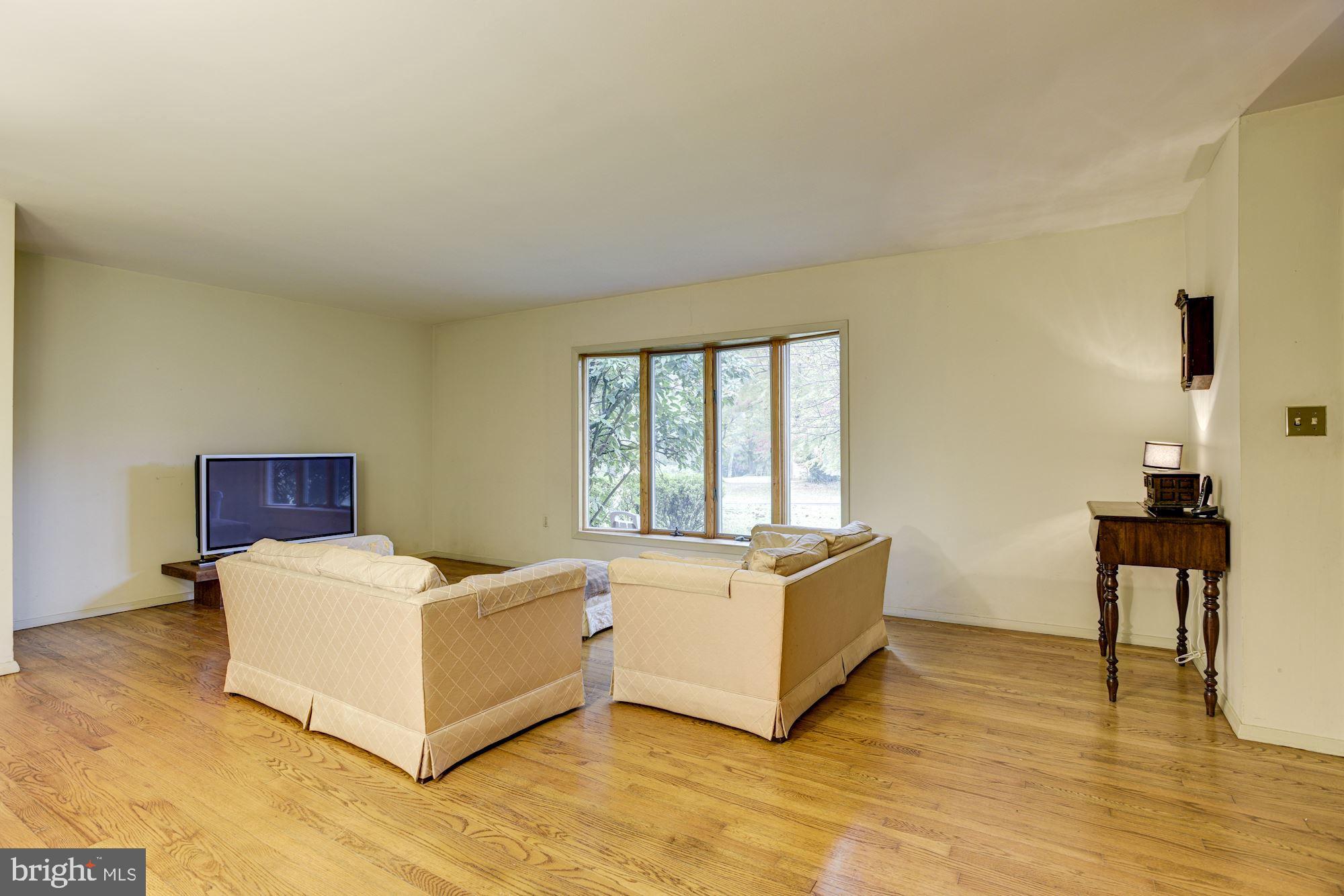 Living Room | Hardwood Floors | Bow Window