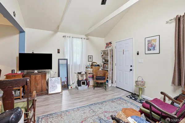 a kitchen with stainless steel appliances a stove a sink cabinets and a window