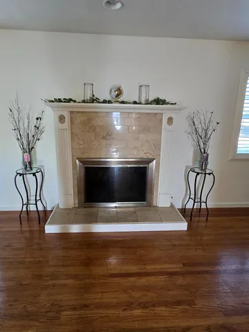 a view of fireplace with wooden floor