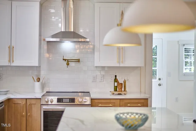 a kitchen with a stove and a cabinets