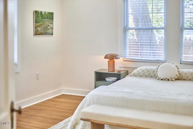 a bedroom with a bed and window