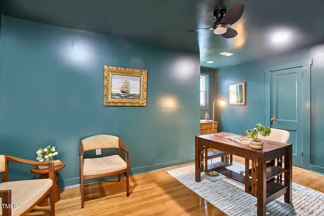 a room with a table and chairs