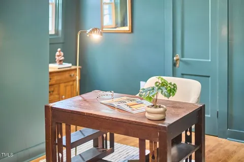 a dining room with a table and chairs