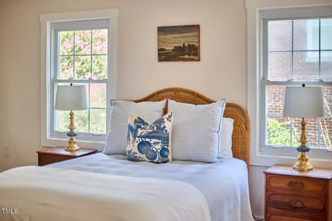 a bedroom with bed and a window