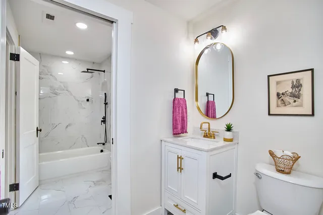 a bathroom with a bathtub and a shower