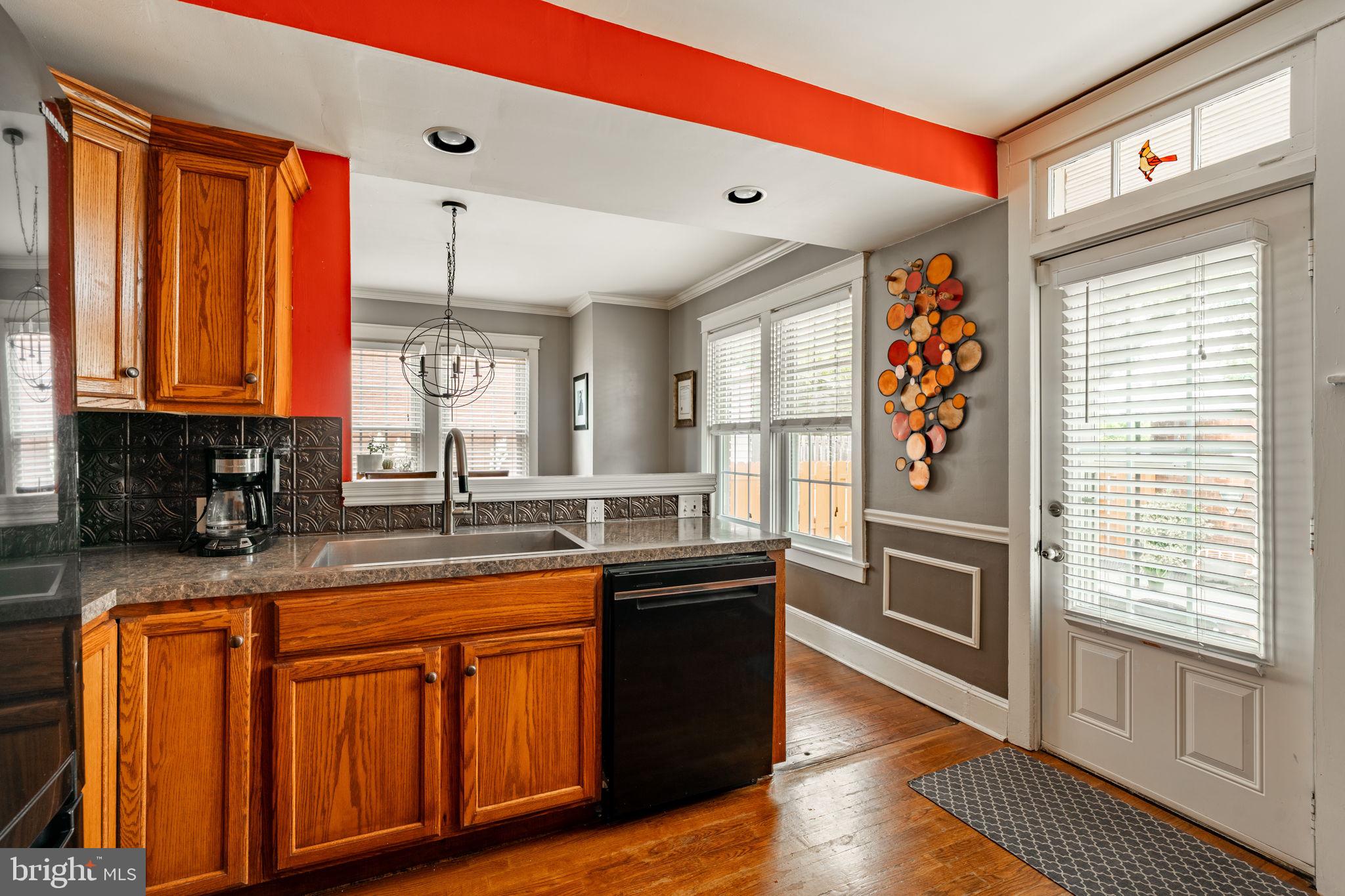 227 Ruby Street Lancaster, PA 17603 - Photo 11 of 42 a kitchen with stainless steel appliances granite countertop a sink and wooden cabinets