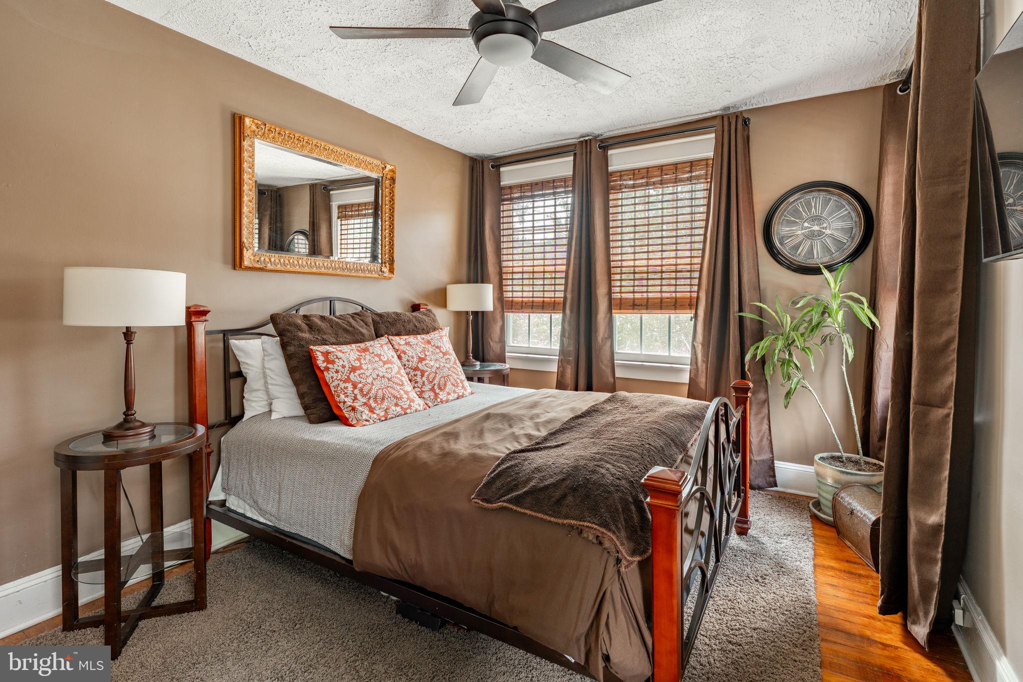 227 Ruby Street Lancaster, PA 17603 - Photo 13 of 42 a bedroom with a bed and a chandelier