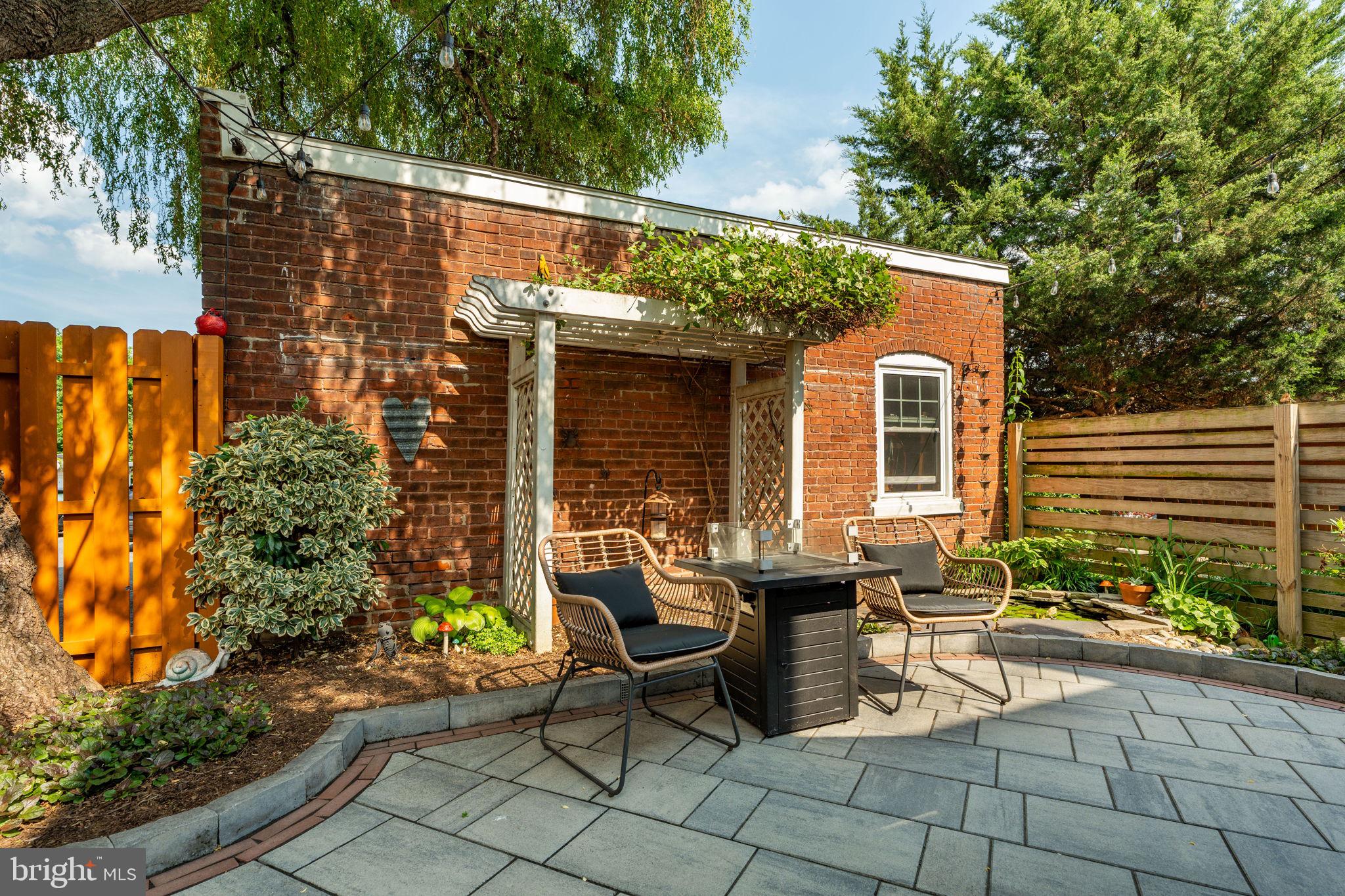 227 Ruby Street Lancaster, PA 17603 - Photo 28 of 42 a view of a patio with table and chairs and potted plants