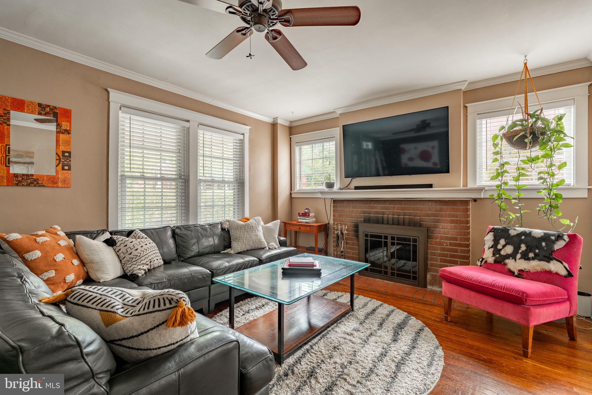 227 Ruby Street Lancaster, PA 17603 - Photo 3 of 42 a living room with furniture a flat screen tv and a fireplace