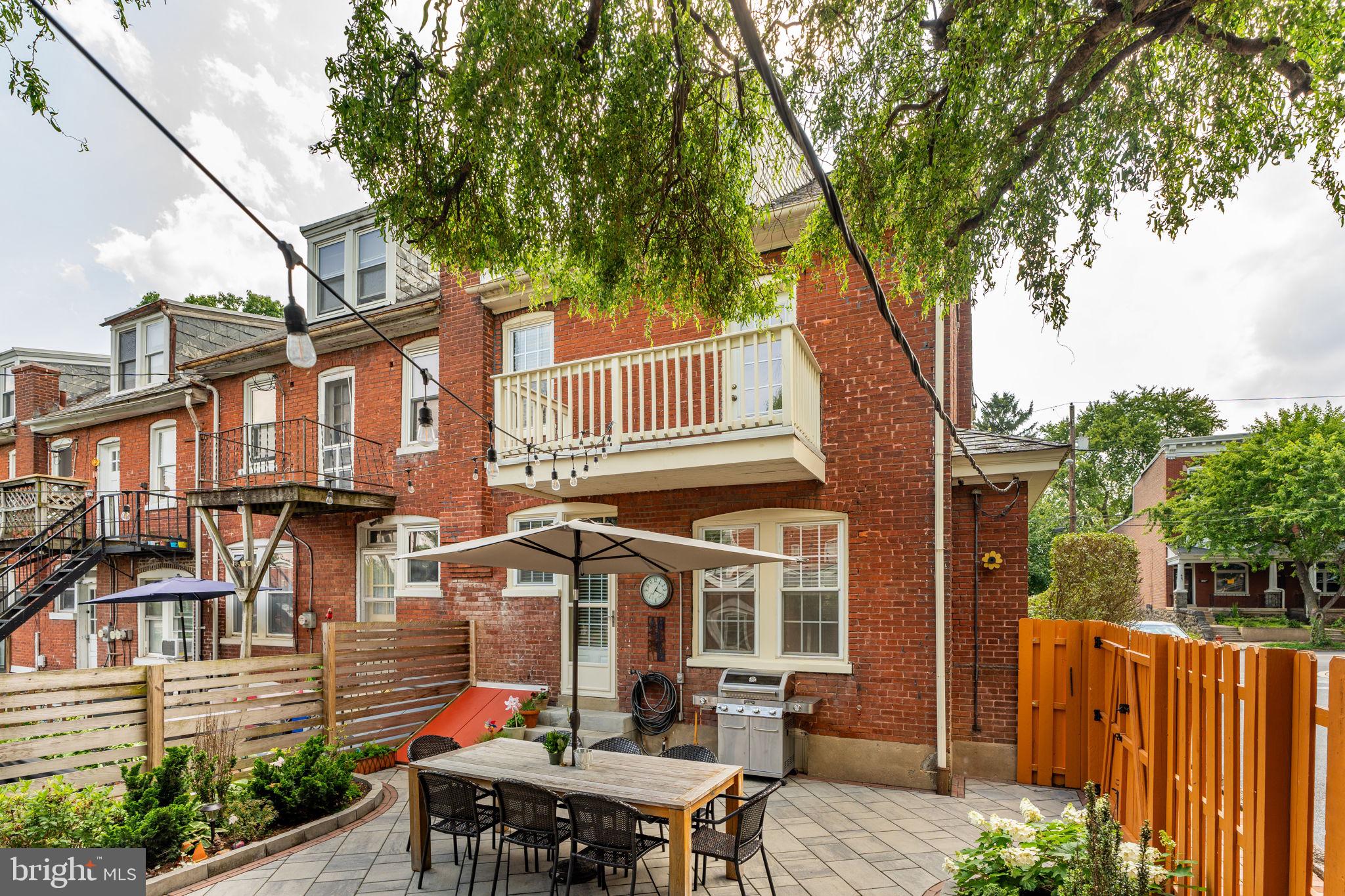 227 Ruby Street Lancaster, PA 17603 - Photo 32 of 42 a view of a house with a chairs and table in a patio