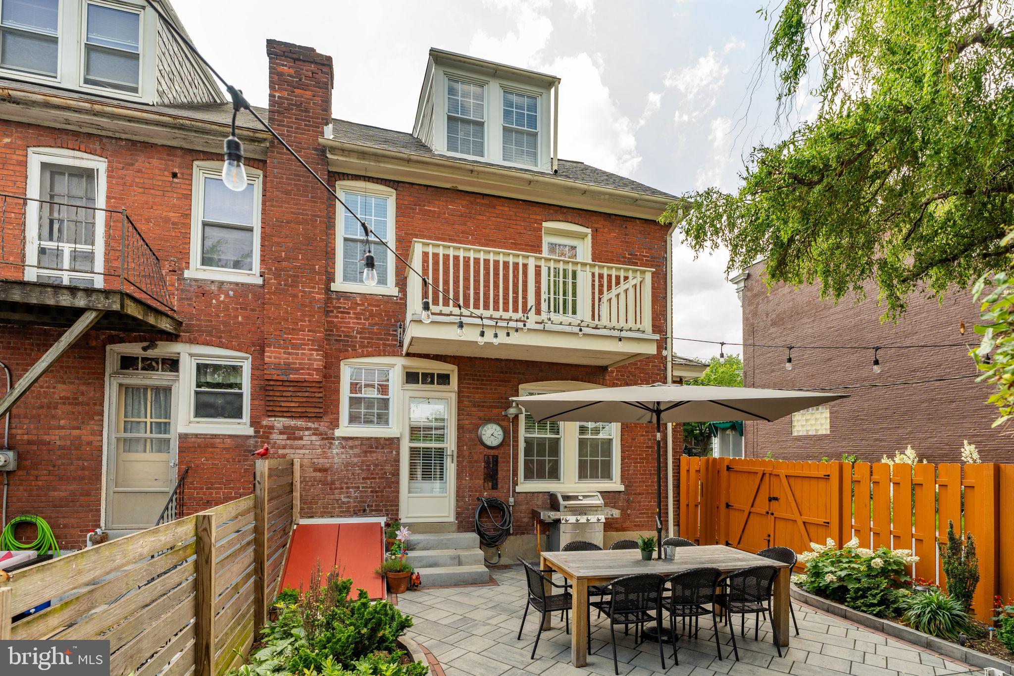 227 Ruby Street Lancaster, PA 17603 - Photo 34 of 42 a view of a cafe with a table and chairs under an umbrella